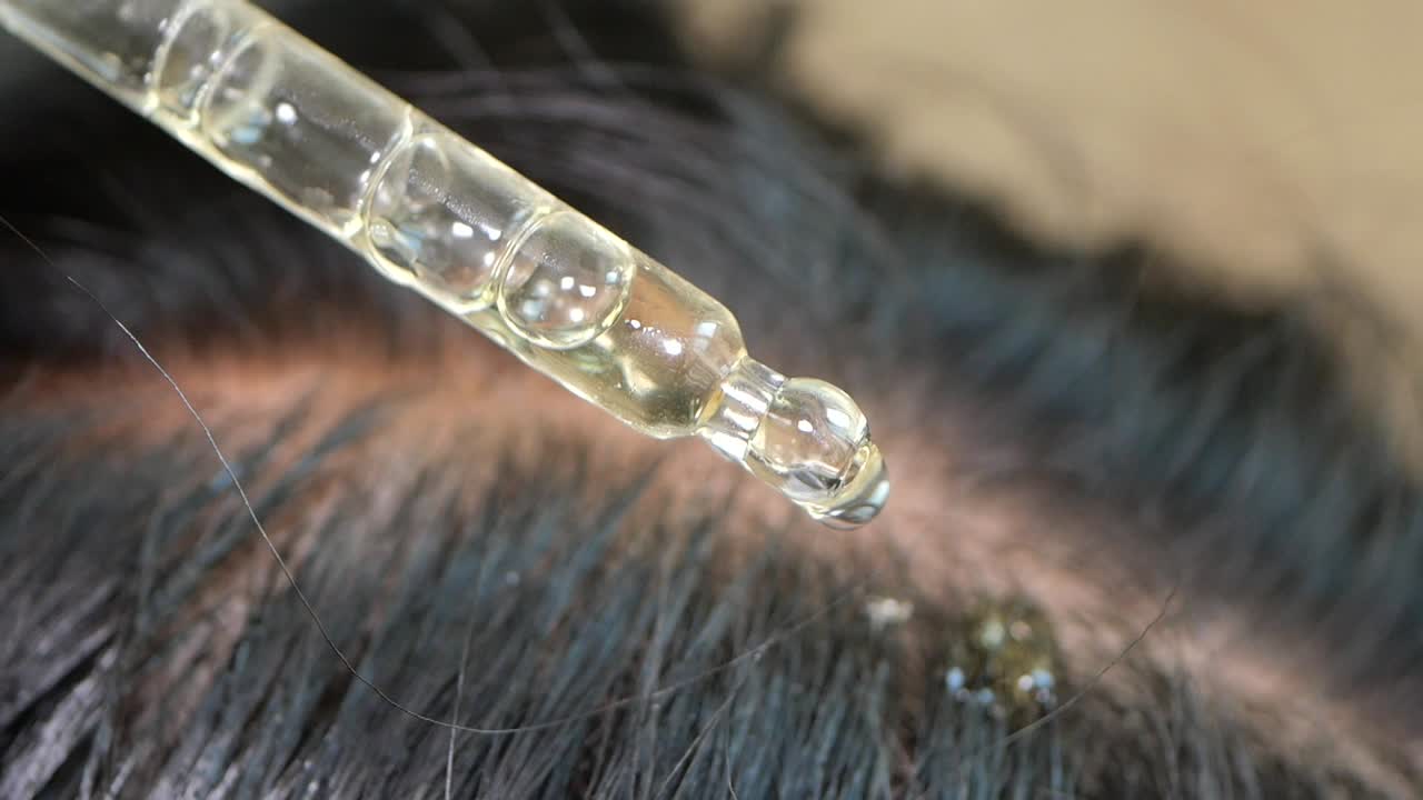 Applying Hair Serum to Scalp