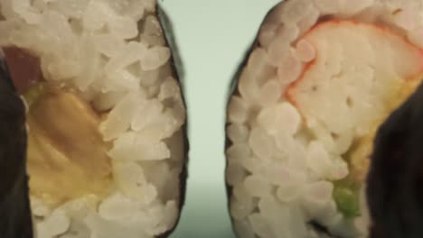 studio shot of sushi rolls on blue background