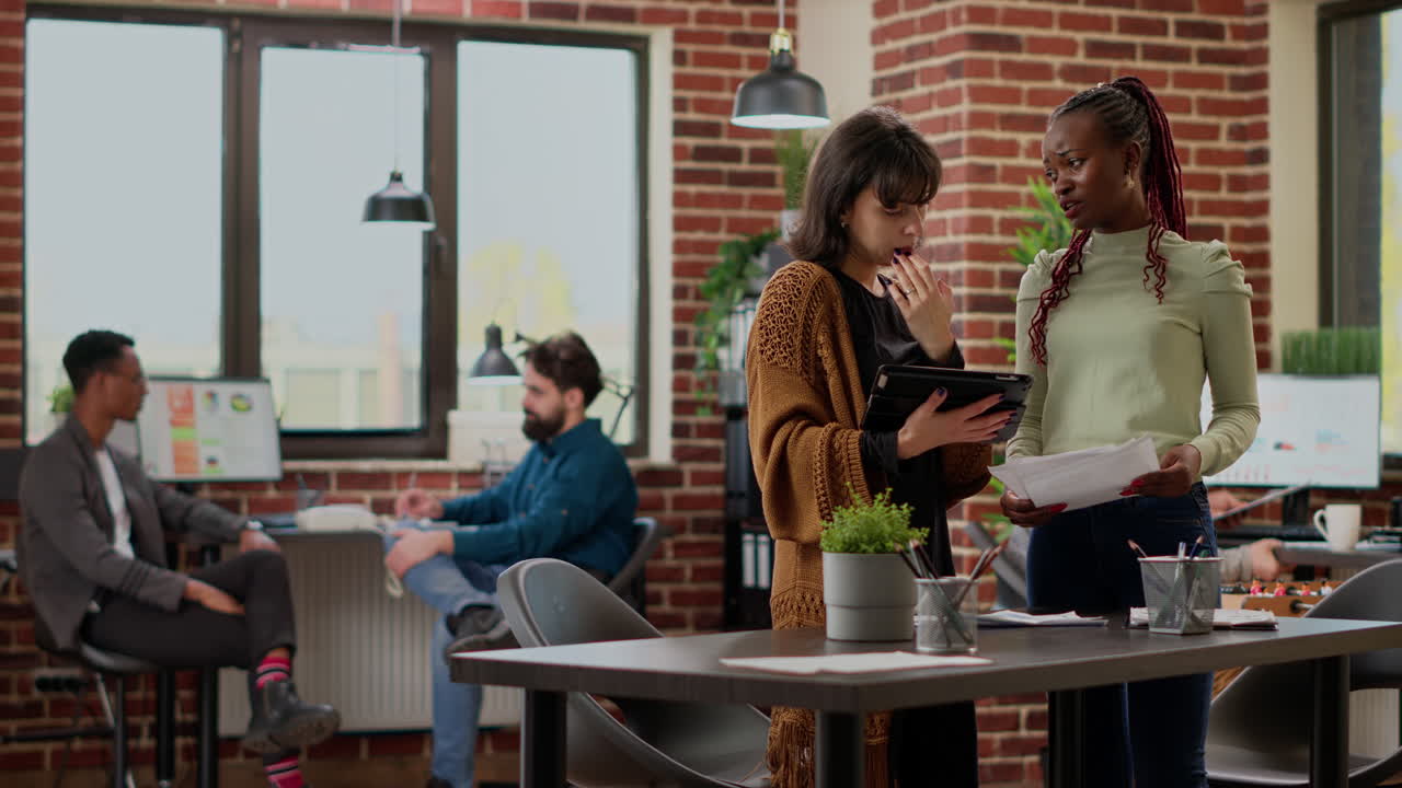 Business women working together on research data to plan project