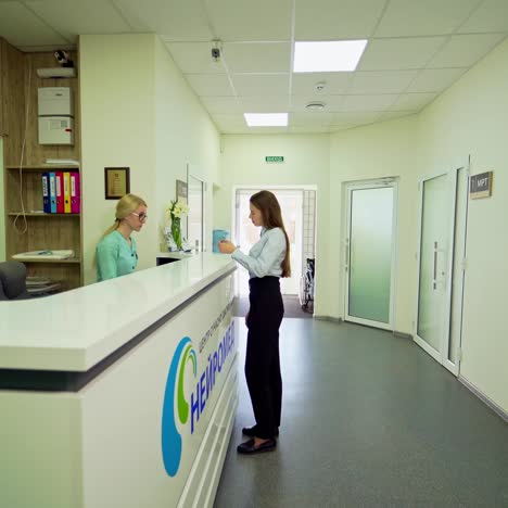 young woman in modern hospital. female in clinic for examination at the doctor. beautiful woman at the receptionist in medical center.