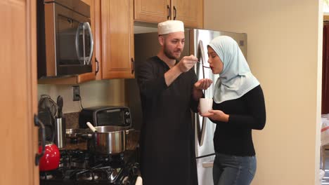 middle eastern young couple with soup she sips track right