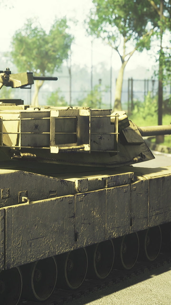 Military tank on a road near trees during daytime in a city area
