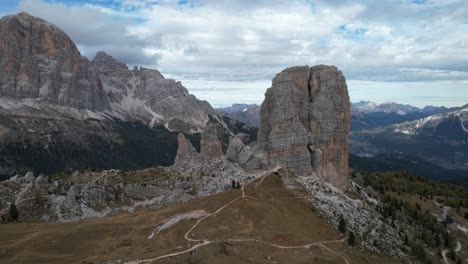 slow pan around cinque torri unique rock formation surrounded by mountains dolomites 4k