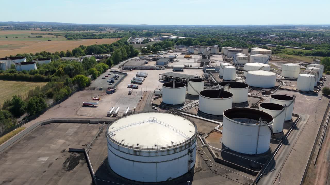 Aerial drone video of chemical plant and fuel silos in Kingsbury England UK showing petroleum diesel gas energy storage and industrial infrastructure