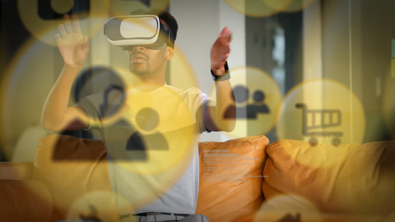 집에서 vr 헤드 ⁇ 을 착용 한 아프리카계 미국인 남성에 대해 떠다니는 여러 개의 노란색 디지털 아이콘
