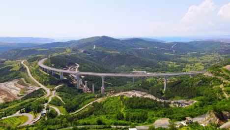 stunning 4k drone footage of the iconic črni kal bridge in slovenia, a masterpiece of architecture amid breathtaking natural surroundings