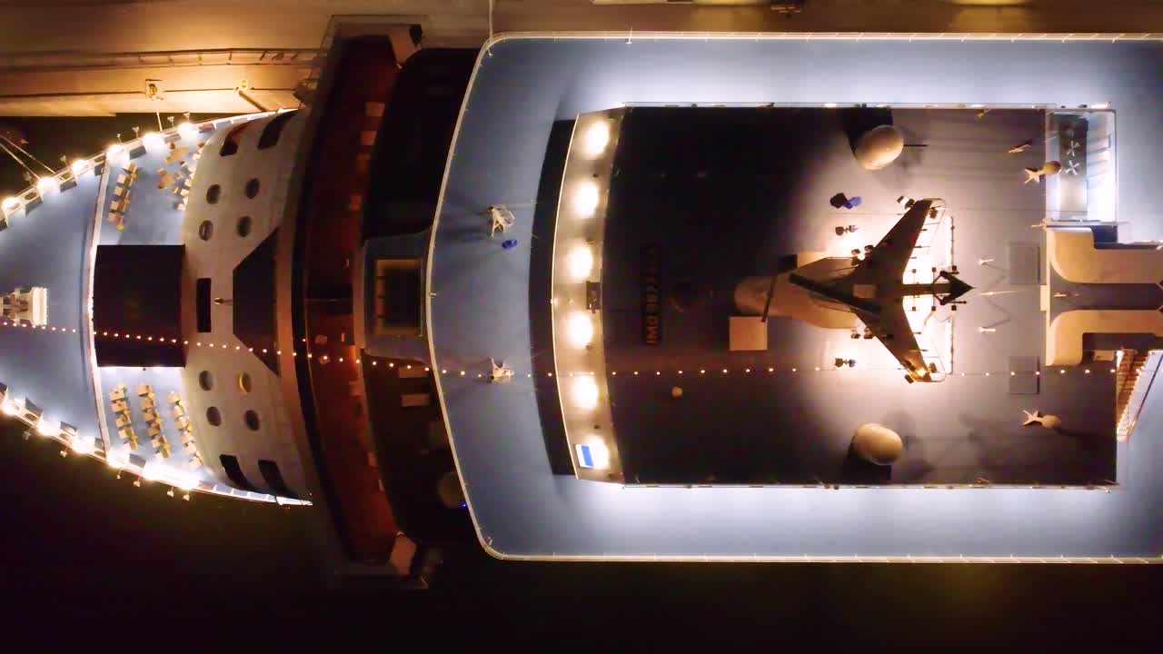 Luxurious deck of a luxury yacht cruise ship at night. Aerial top down view