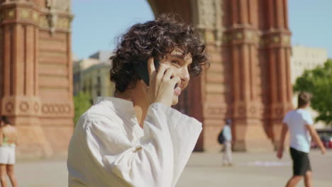 Portrait-of-cheerful-guy-talking-cellphone.-Happy-man-finishing-smartphone-call.