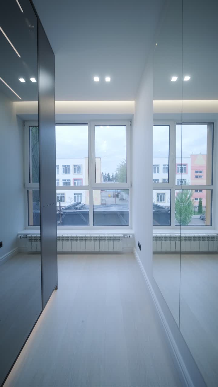 Sleek Modern Wardrobe Hallway with Reflective Black Doors