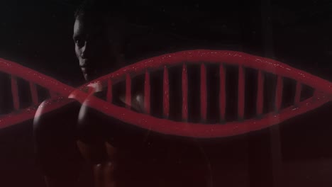 Animation-Eines-DNA-Stammes,-Der-Sich-über-Einen-Mann-Dreht,-Der-Mit-Boxhandschuhen-Trainiert