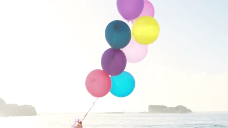 retired old couple holding balloons