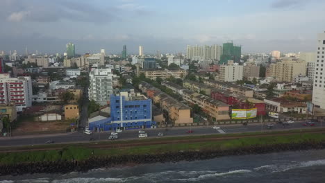aerial descends to colombo plan road, sri lanka waterfront street
