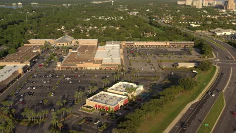 drone view panning left from highway 98 to silver sands outlet mall in destin florida