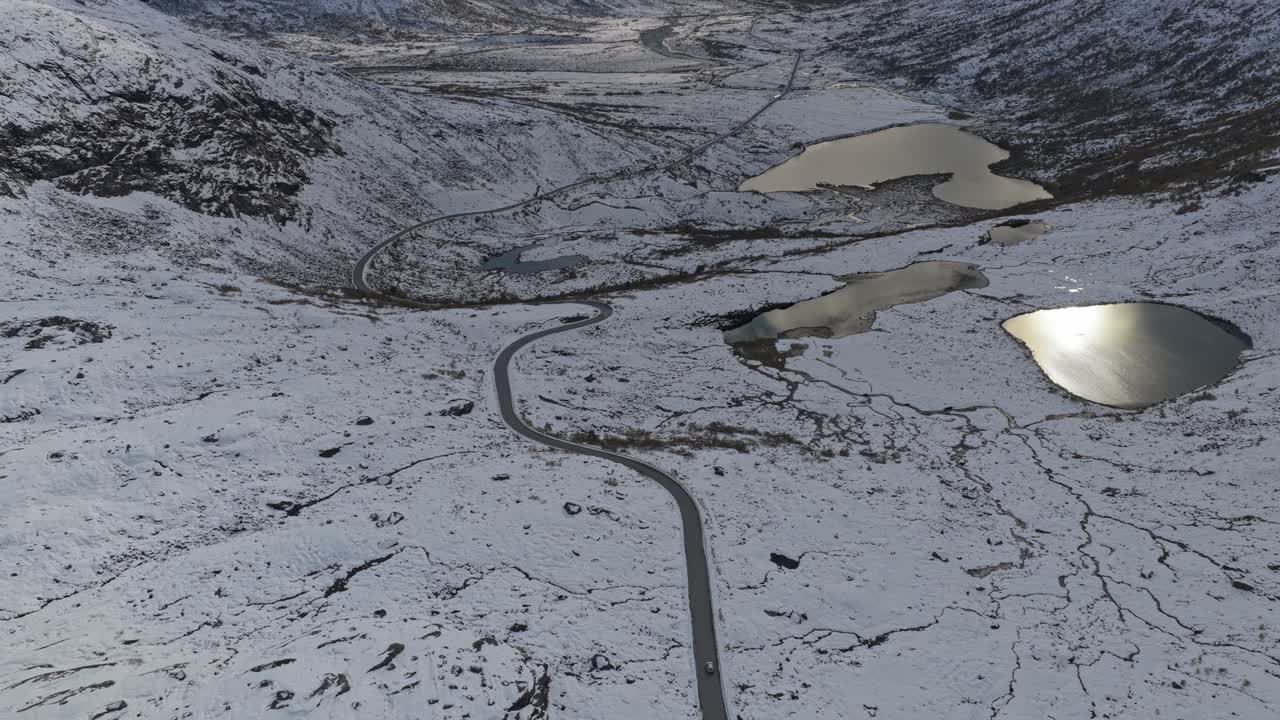 Mountain pass covered in snow, seen from above in Norway
