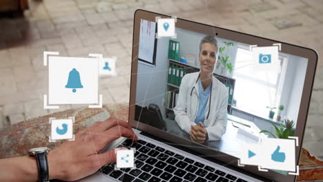 digital internet icons over man using laptop during video call.