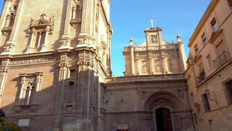spectacular cathedral of murcia. view of bell tower. camera tilt down from the tower to the main entrance. famous travel destination in spain.