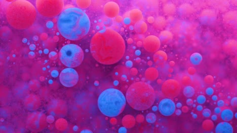 slow motion bright neon color bubbles oil beautiful fluorescent paint sparkling color moving multicolor close up. acrylic neon paint. fantastic surface. abstract colorful transformation gravitation.