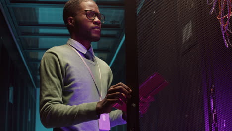 it specialist working in server room of data center