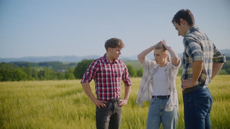 farmers discussing in a wheat field