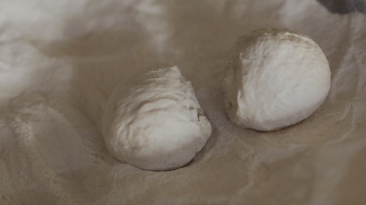 Dough Being Rolled In Flour During The Making Of Naan Bread.