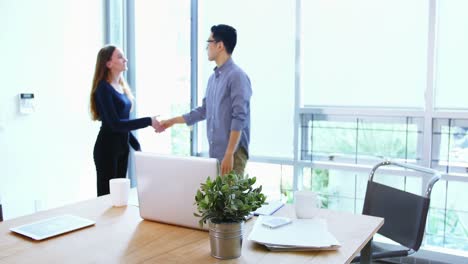 business executives shaking hands with each other