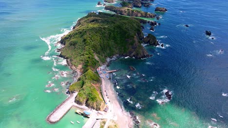 Aerial-View-Of-Beach-Coastline-With-Tilt-Up-View-Of-Estaquilla-Islands-Out-To-Turquoise-Pacific-Ocean-Waters-Spanning-Across-Out-To-Horizon