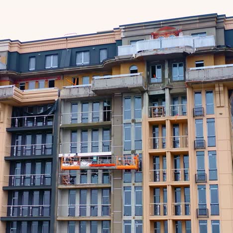 building of a modern block of flats. construction of a tower building in the city. front view of a high-rise architecture.