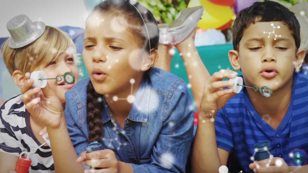 Boy and girl blowing bubbles at backyard party, girl lifting wand creating sparkles peers joining