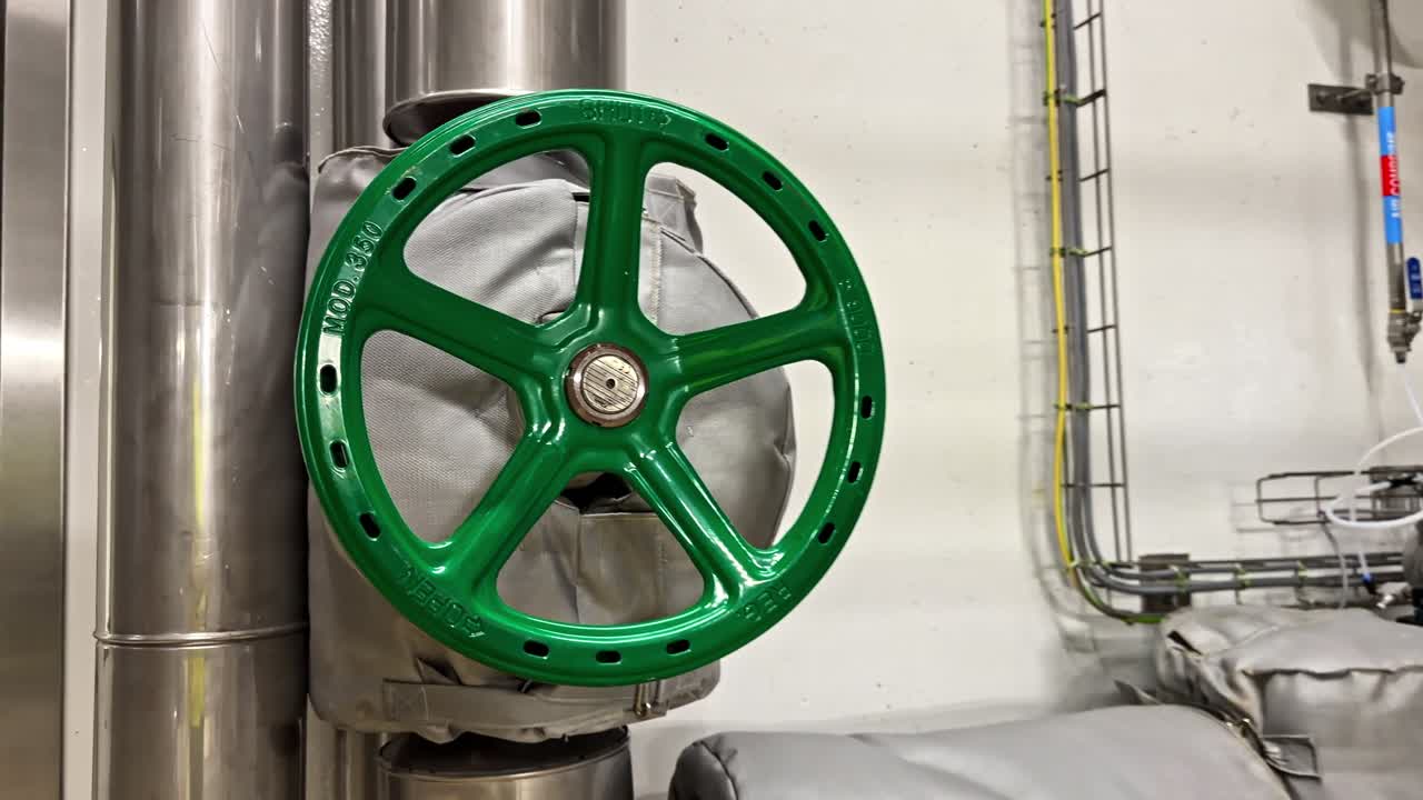 The shielded pipes and taps of a dairy product processing line during pasteurization