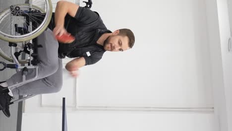 a young man in a wheelchair plays table tennis in the hall wheelchair tennis a young man in a wheelchair plays table tennis in the hall wheelchair tennis video