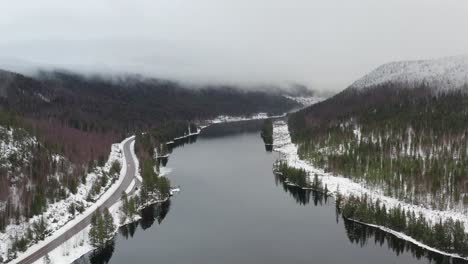 the end of a manmade lake with a dam generating electricity in the winter of sweden