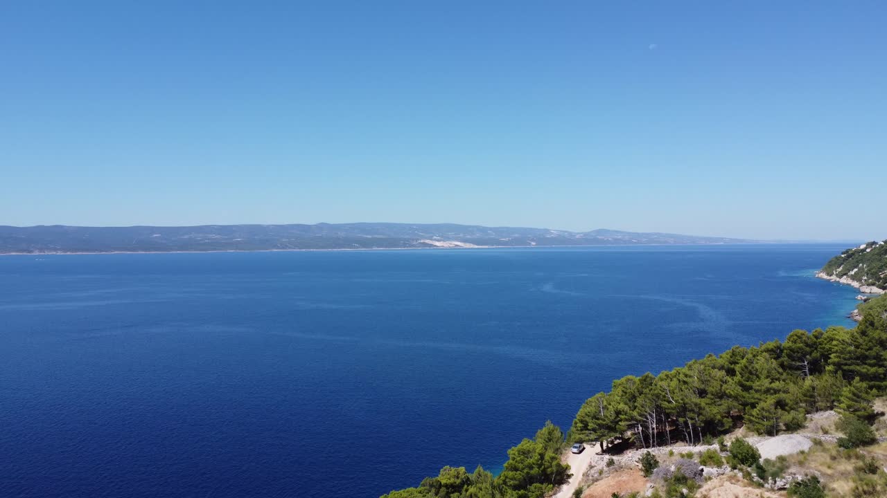 view towards the island of brac in Dalmatia on the breathtaking Adriatic Sea, the sun is shining