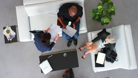 Paperwork,-documents-and-a-meeting-on-a-sofa