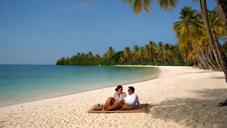 couple relaxing on a tropical beach