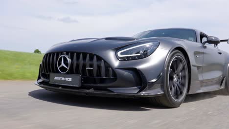 close-up of sleek black sports car in motion on a road mercedes benz