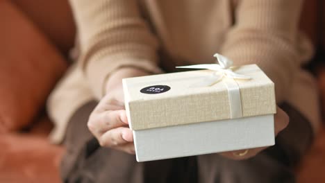 woman holding a beautifully wrapped gift