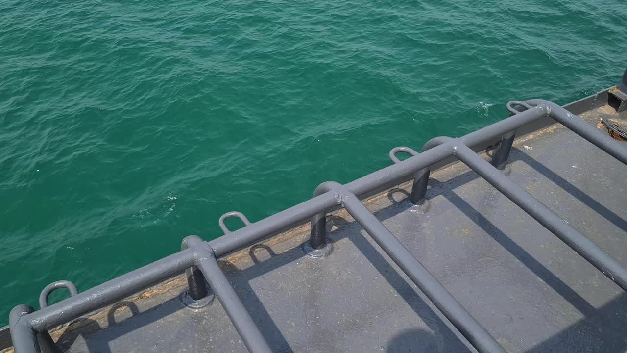 Ferryboat Side Deck While Cruising in Turquoise Sea Water, Close Up Detail