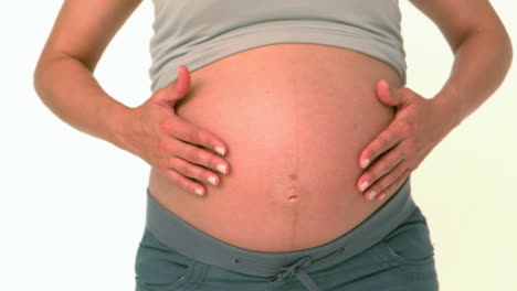 pregnant woman rubbing her belly