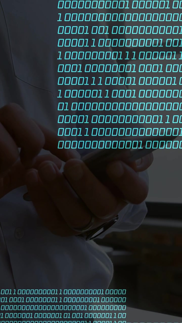 Vertical video: Male left-finger tapping phone in tech, binary overlay growing over hands for data