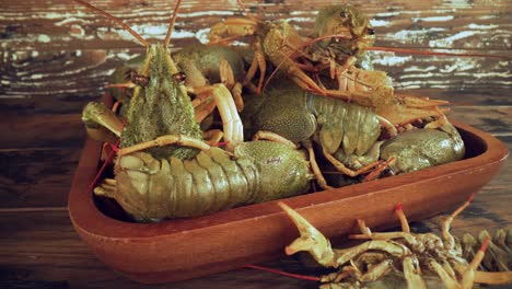 live crayfish on a wooden table