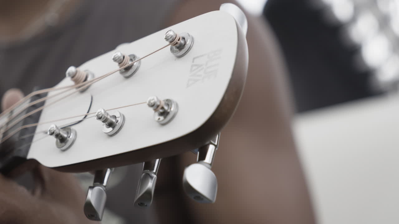 man playing guitar closeup