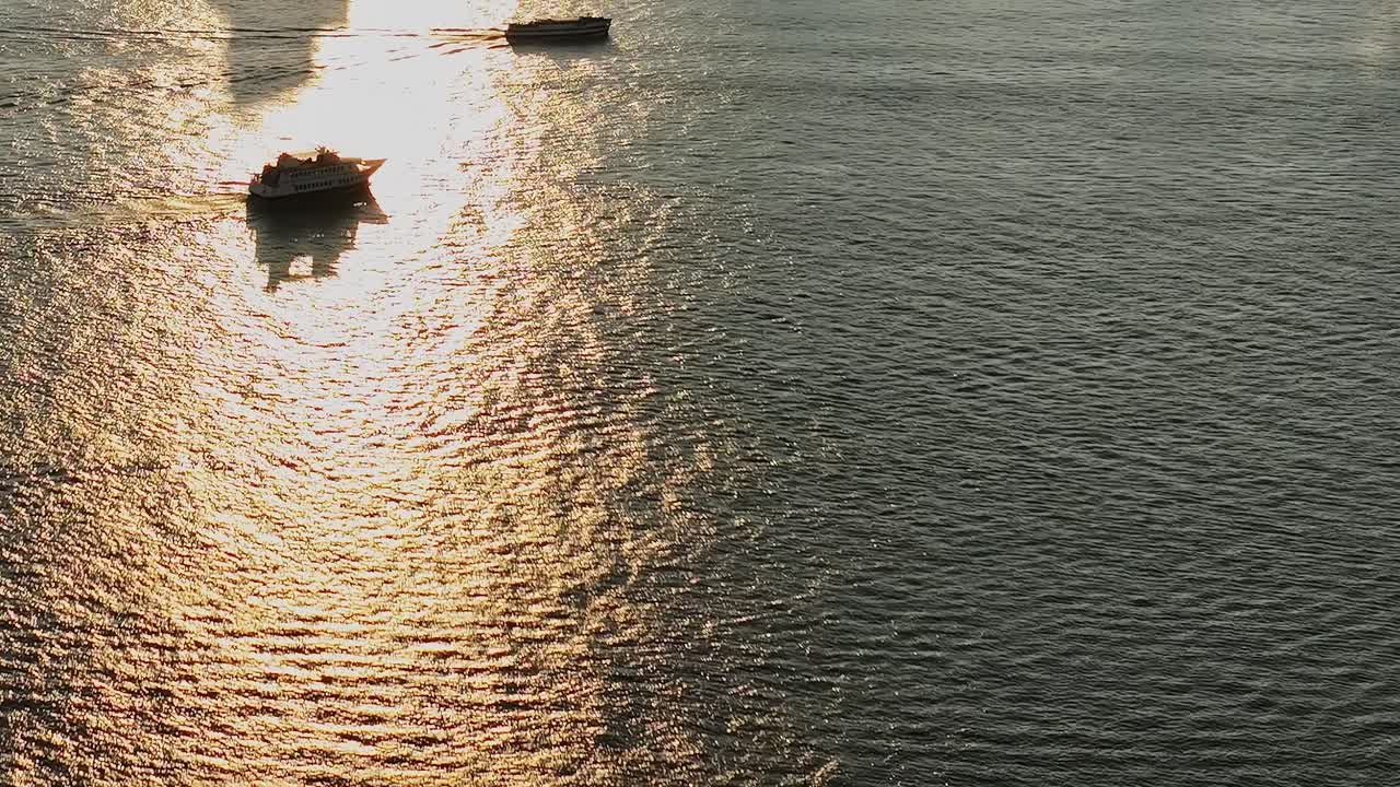 Sunset view of boats sailing on the waters of New York City