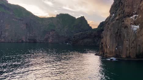 Voyage-through-Westman-Islands,-view-on-Beluga-Sanctuary-between-cliffs