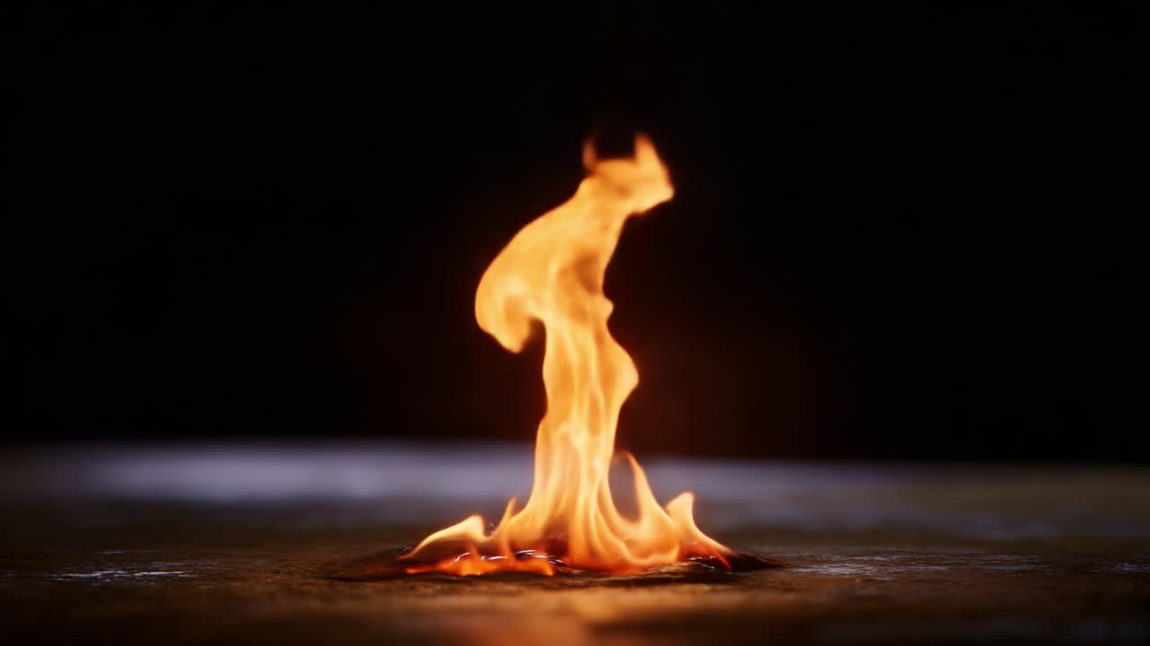 Dynamic Flames Dancing in a Dark Space: Captivating Visuals of Fire's Form and Movement Creating a Mesmerizing Atmosphere of Light and Heat