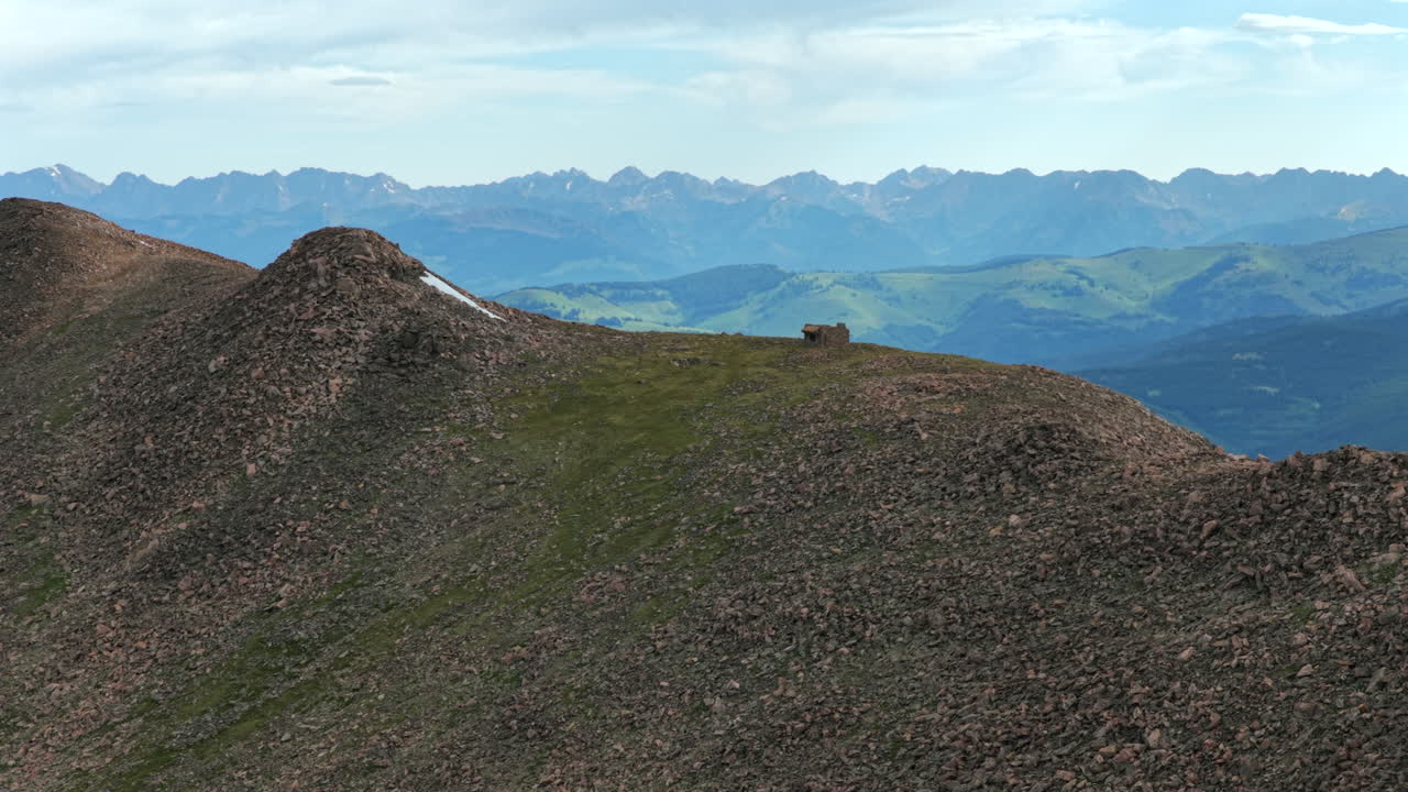 Morning Halo Ridge Notch Mountain Shelter Gore Range Vail Minturn Redcliff aerial drone Colorado sunny blue sky summer Mount Holy Cross 14er peak Wilderness Sawatch Range Rocky Mountains forwards pan