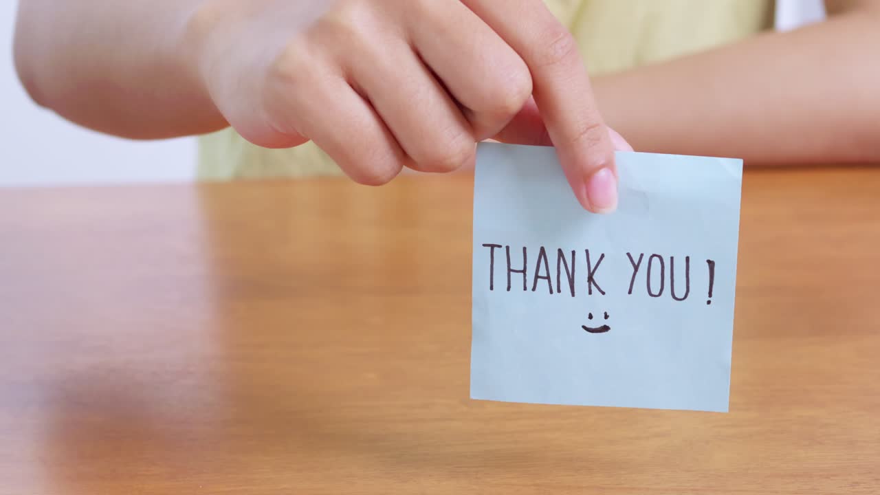 A close-up of a thank-you note highlights the importance of gratitude daily life