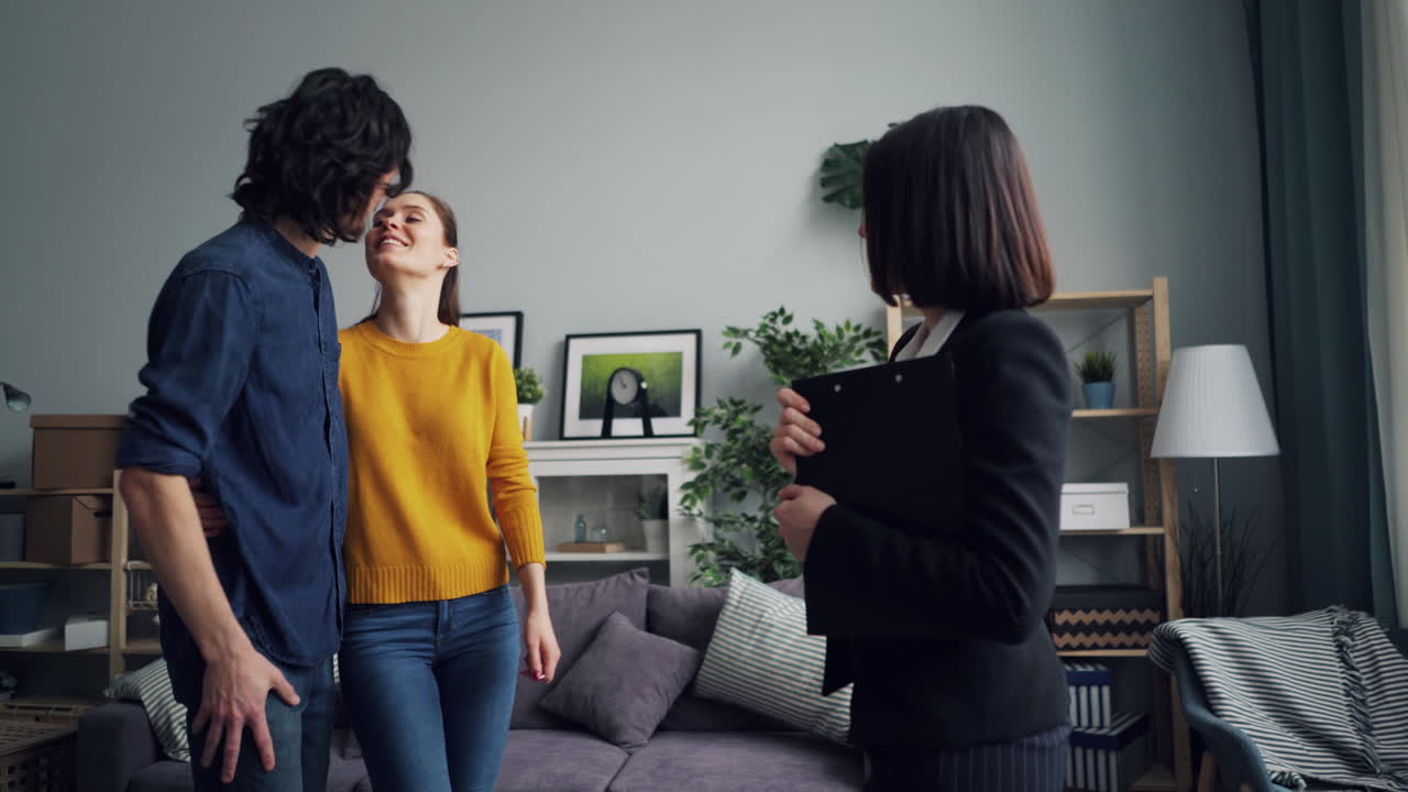 Couple Receiving House Keys from Real Estate Agent