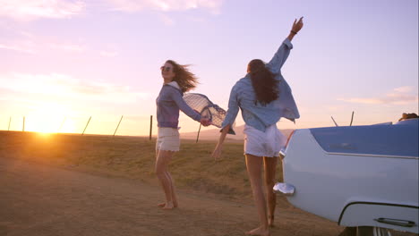 two friends having fun outside on a field