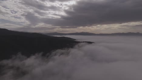 Aerial-view-of-a-sea-mist-whit-mountains