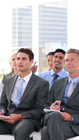 business people asking question during presentation